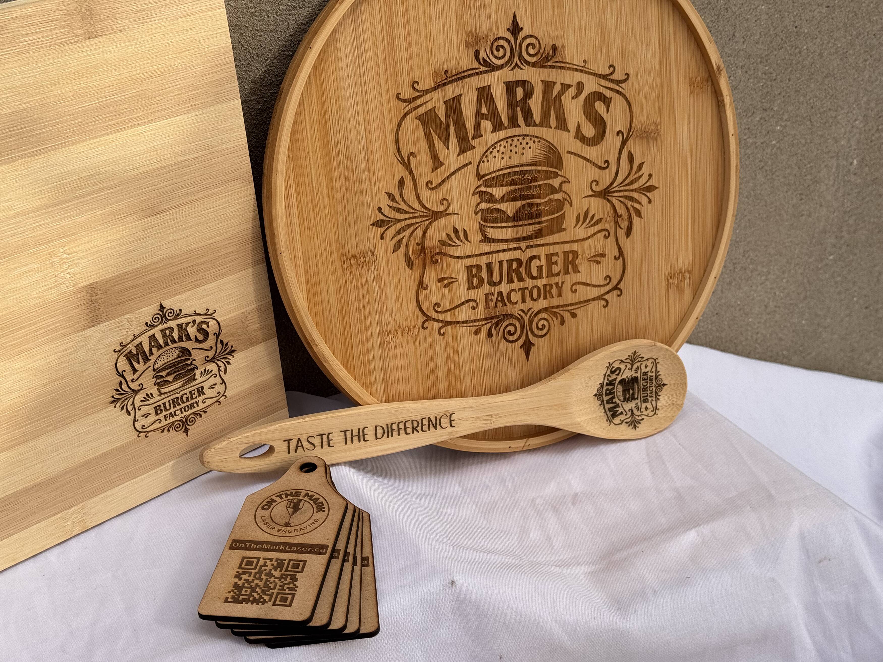 Mark’s personalized wooden serving board, cutting board, utensils and coasters